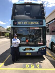 CDC Staff Standing In Front Of A Hillsbus Bus With Movember Moustaches Scaled