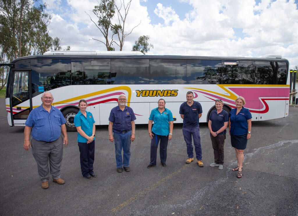 Youngs Group Staff Standing In Front Of A Bus